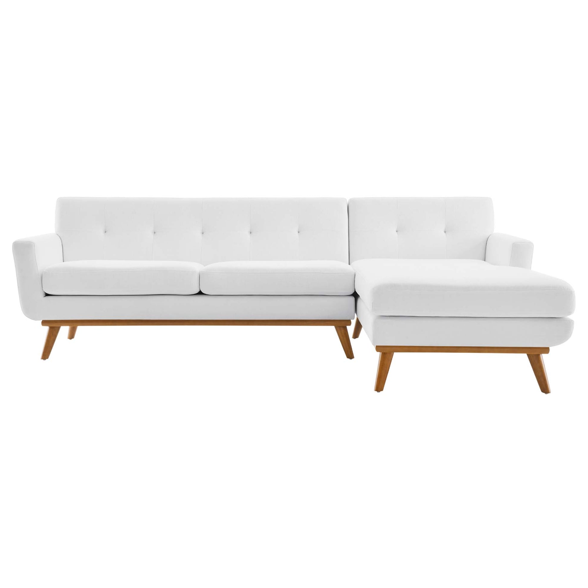 White fabric sectional sofa with chaise on right, tufted back cushions, natural wood legs.