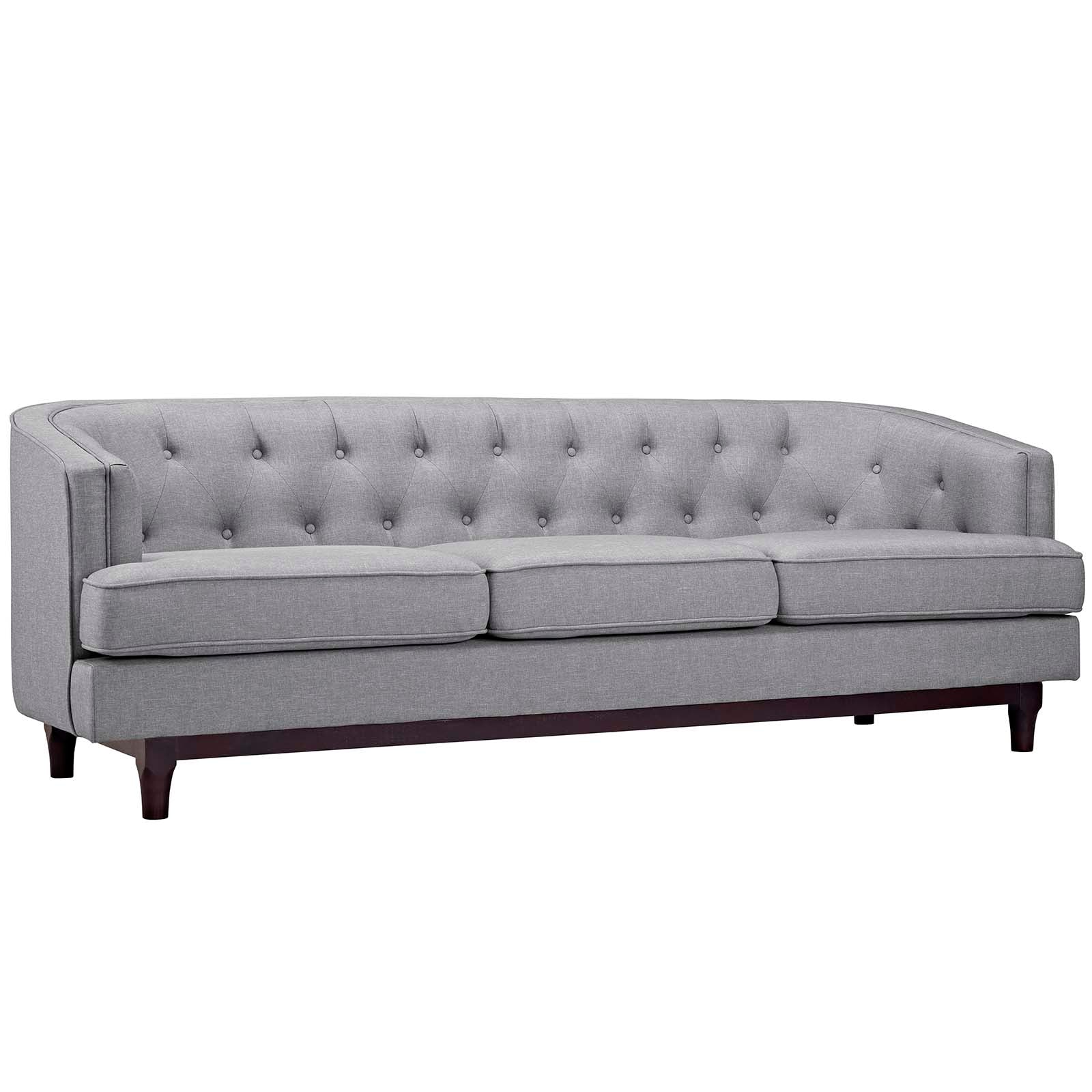 Gray fabric tufted sofa with curved back, three seat cushions & dark wooden legs.