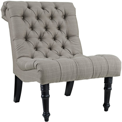Granite upholstered fabric lounge chair with diamond button tufting, rolled arms and dark turned wood legs.