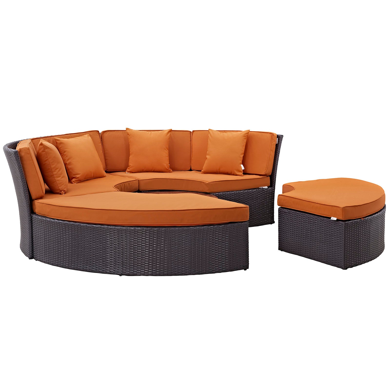 Dark brown wicker circular outdoor daybed set with bright orange cushions and a matching ottoman.