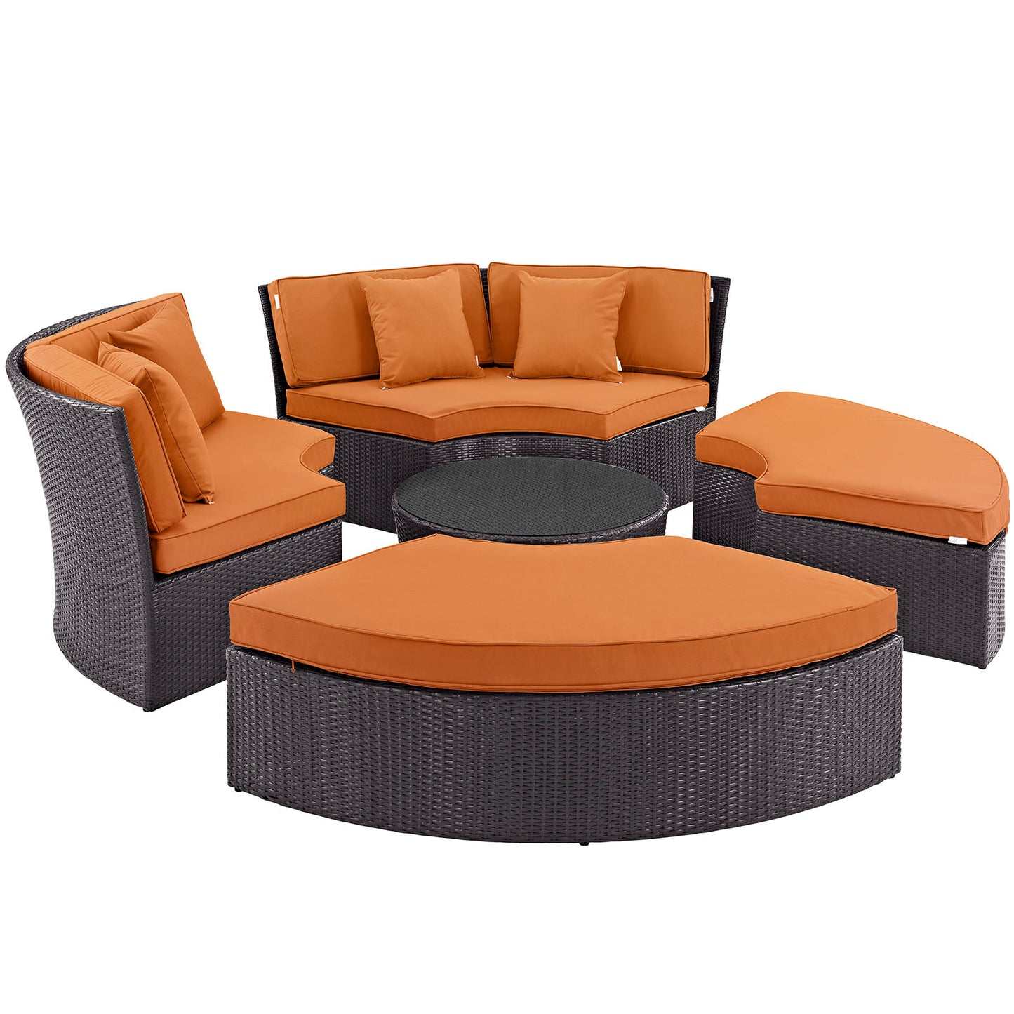 Dark wicker outdoor patio set & orange cushions: curved loveseat, two lounge chairs, round ottoman & circular coffee table.