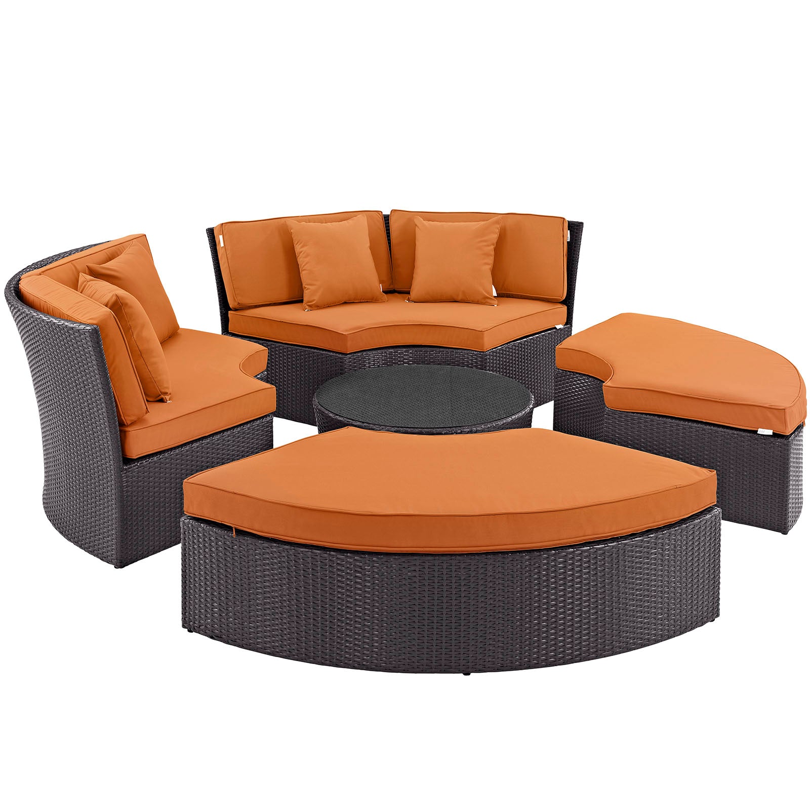 Dark wicker outdoor patio set & orange cushions: curved loveseat, two lounge chairs, round ottoman & circular coffee table.