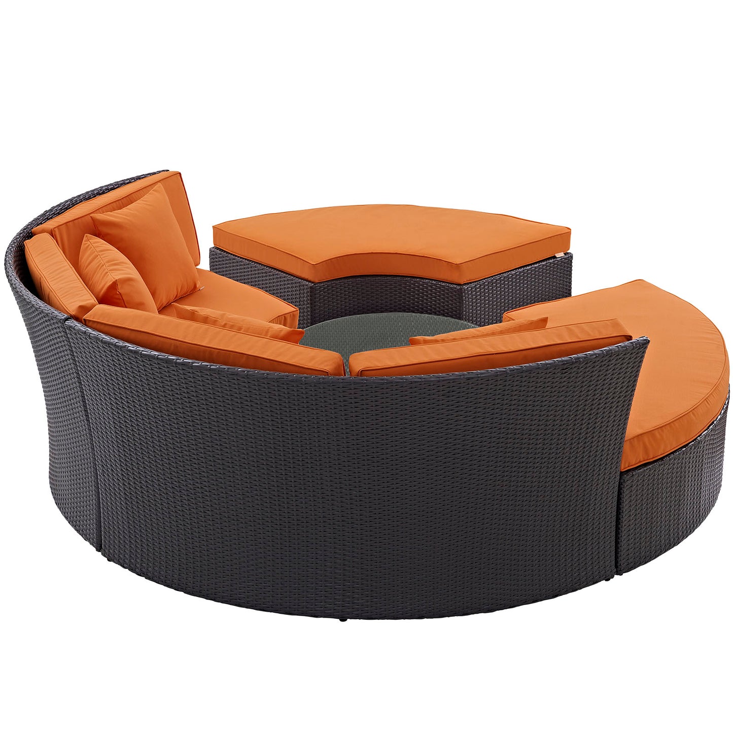 Espresso circular outdoor patio daybed set with bright orange cushions and a matching ottoman, wicker frame.