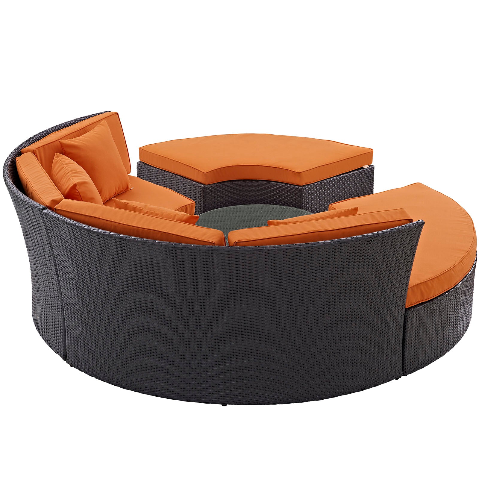 Espresso circular outdoor patio daybed set with bright orange cushions and a matching ottoman, wicker frame.