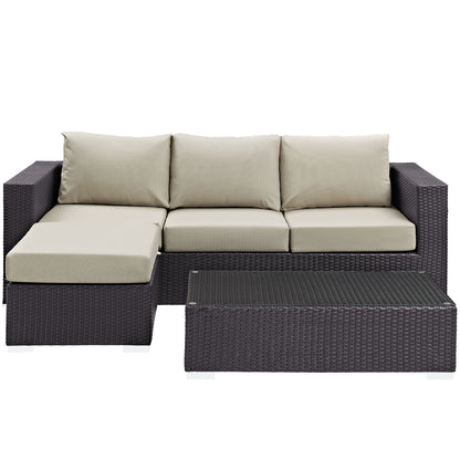 Dark wicker outdoor sectional with beige cushions, left chaise, and matching rectangular coffee table.