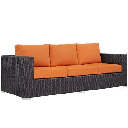 Outdoor dark brown wicker 3-piece patio sofa set with bright orange cushions; square arms & metal feet.