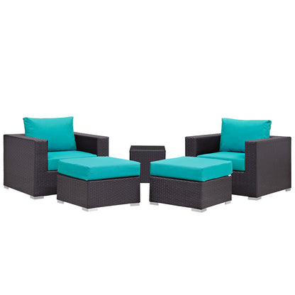 Dark brown wicker 5-piece outdoor patio sectional set with turquoise cushions: 2 armchairs, 2 ottomans & a small center table.