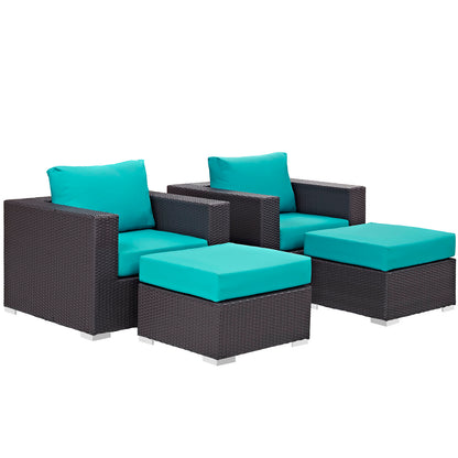 Outdoor wicker 4-piece sectional set with turquoise cushions; two armchairs and two matching ottomans.