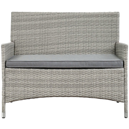 Gray wicker outdoor 4-piece conversation set with tall-back seating, rounded arms, and light gray cushions.