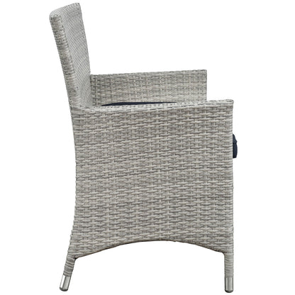 Light gray woven outdoor wicker armchair with high back, curved arms and metal-capped legs; part of a 4-piece outdoor patio conversation set.