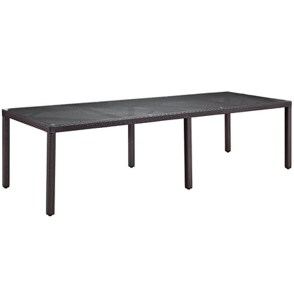 Rectangular espresso red wicker outdoor dining set with a woven top; part of an 11-piece patio dining set.