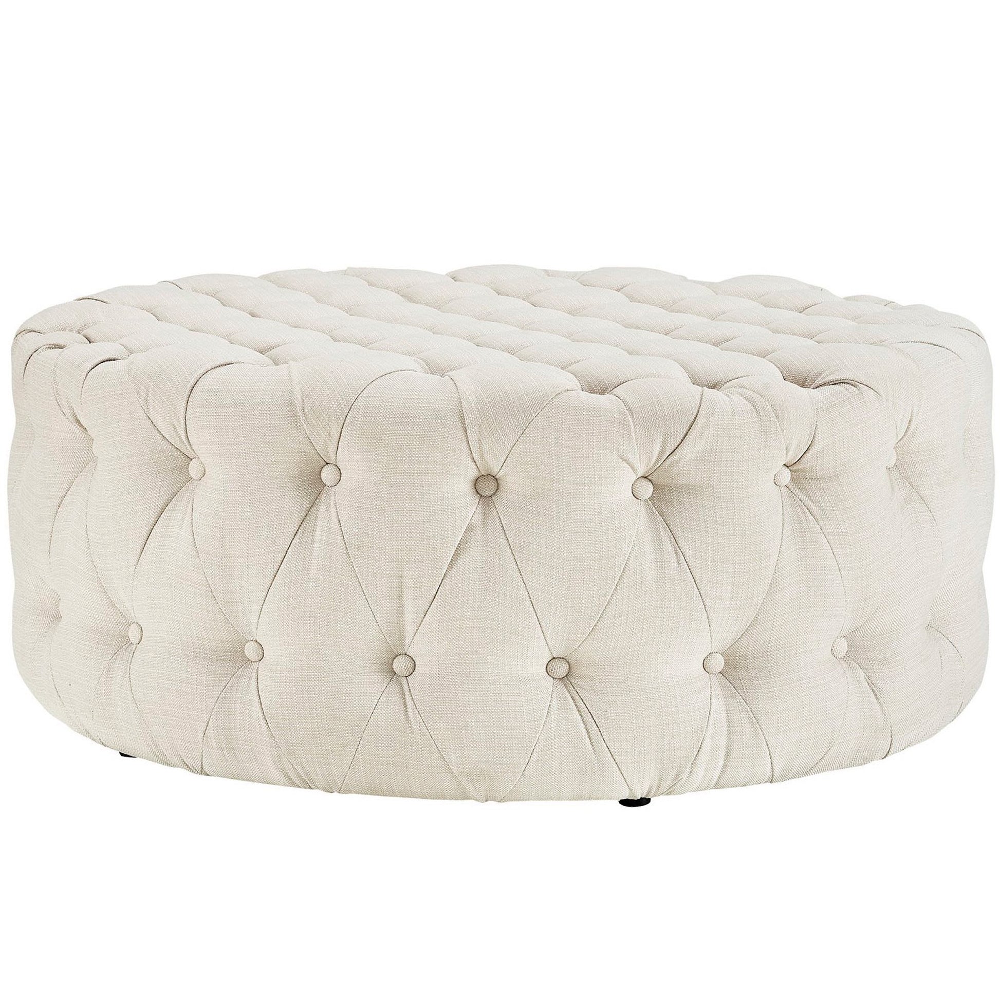Round beige tufted ottoman pouf with button-tufted linen fabric and plush cushioned top.