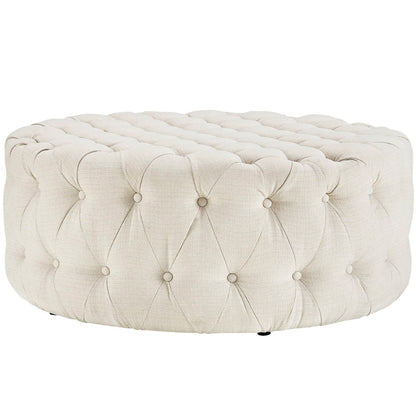 Round beige tufted ottoman pouf with button-tufted linen fabric and plush cushioned top.