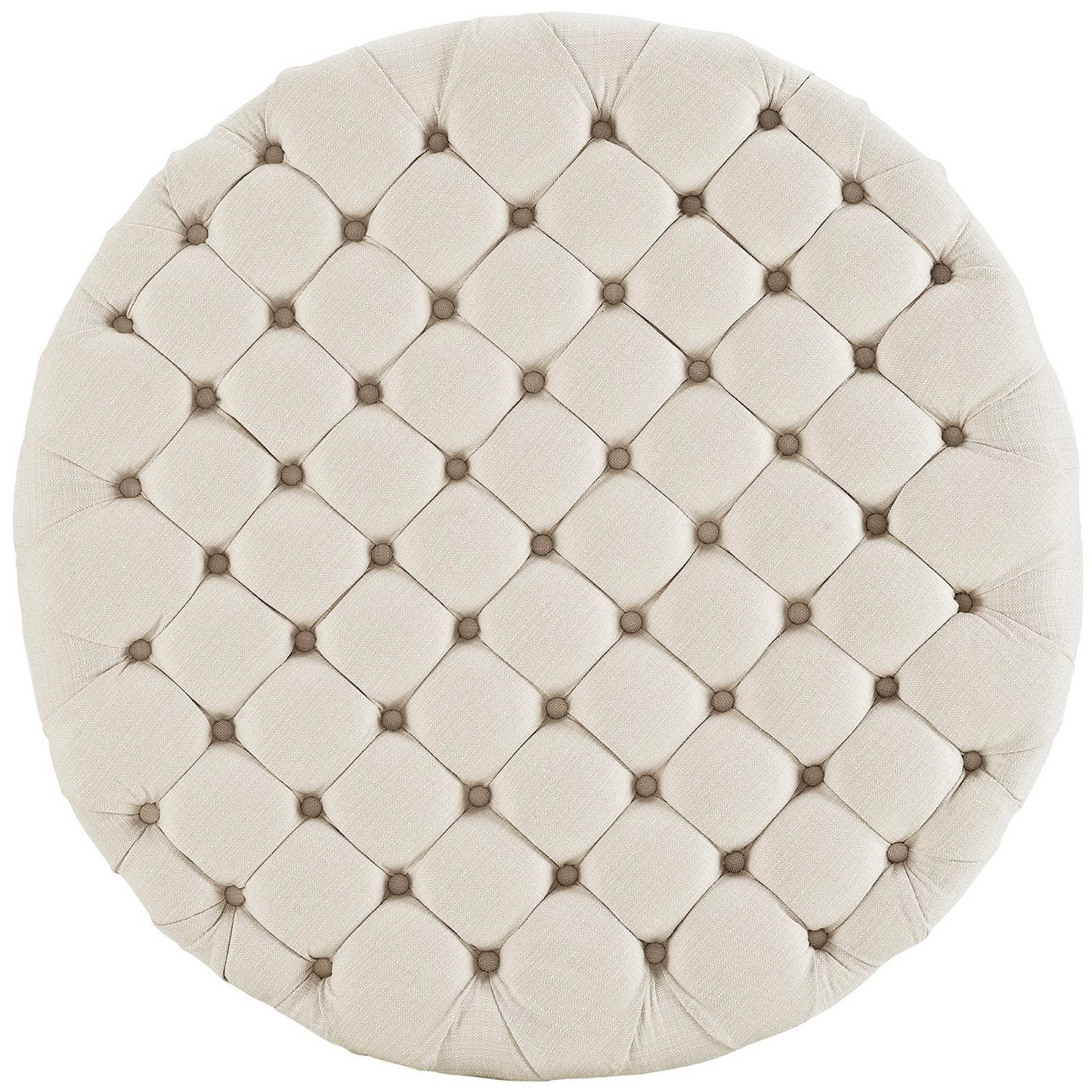Round beige tufted ottoman with a diamond quilted pattern and small center buttons.