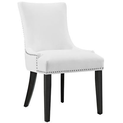 White upholstered dining chair with nailhead stud trim, curved back & cushioned seat on dark wooden legs.