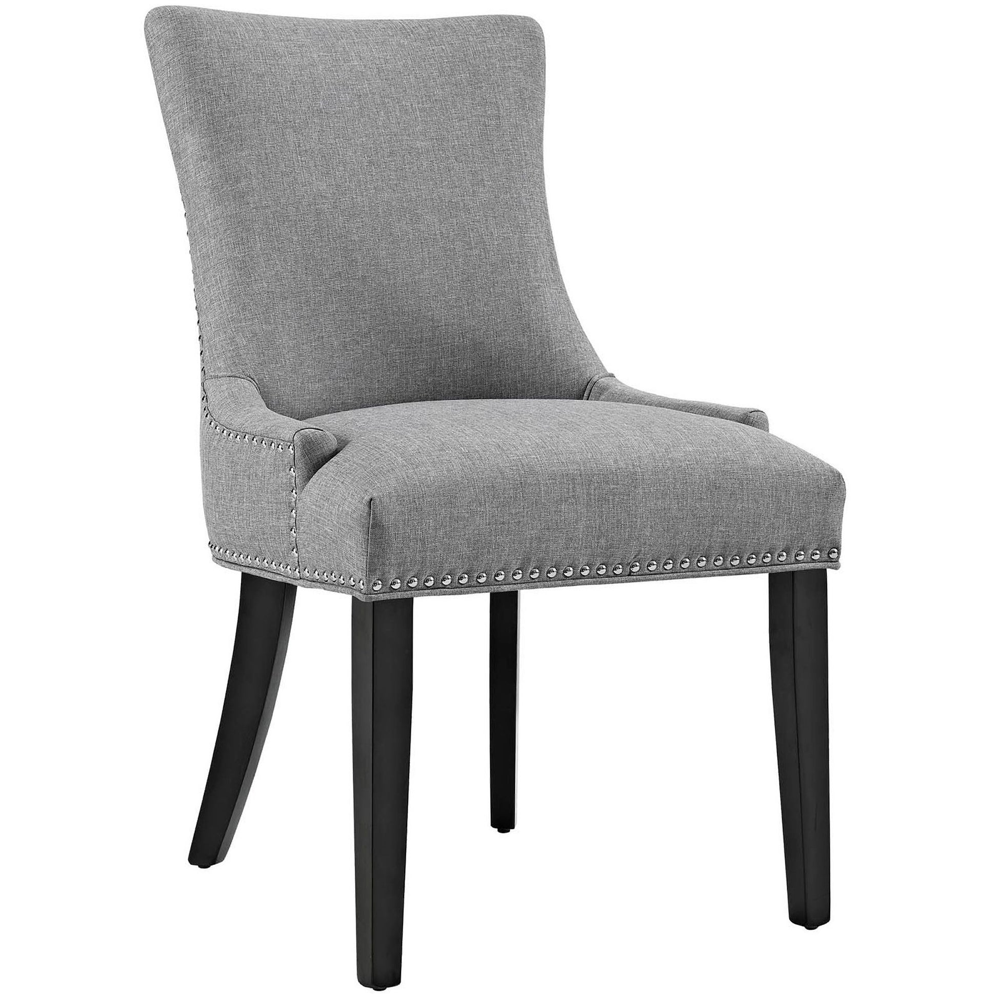Light gray upholstered dining chair with curved tall back, nailhead trim, cushioned seat, and dark-stained wooden legs.
