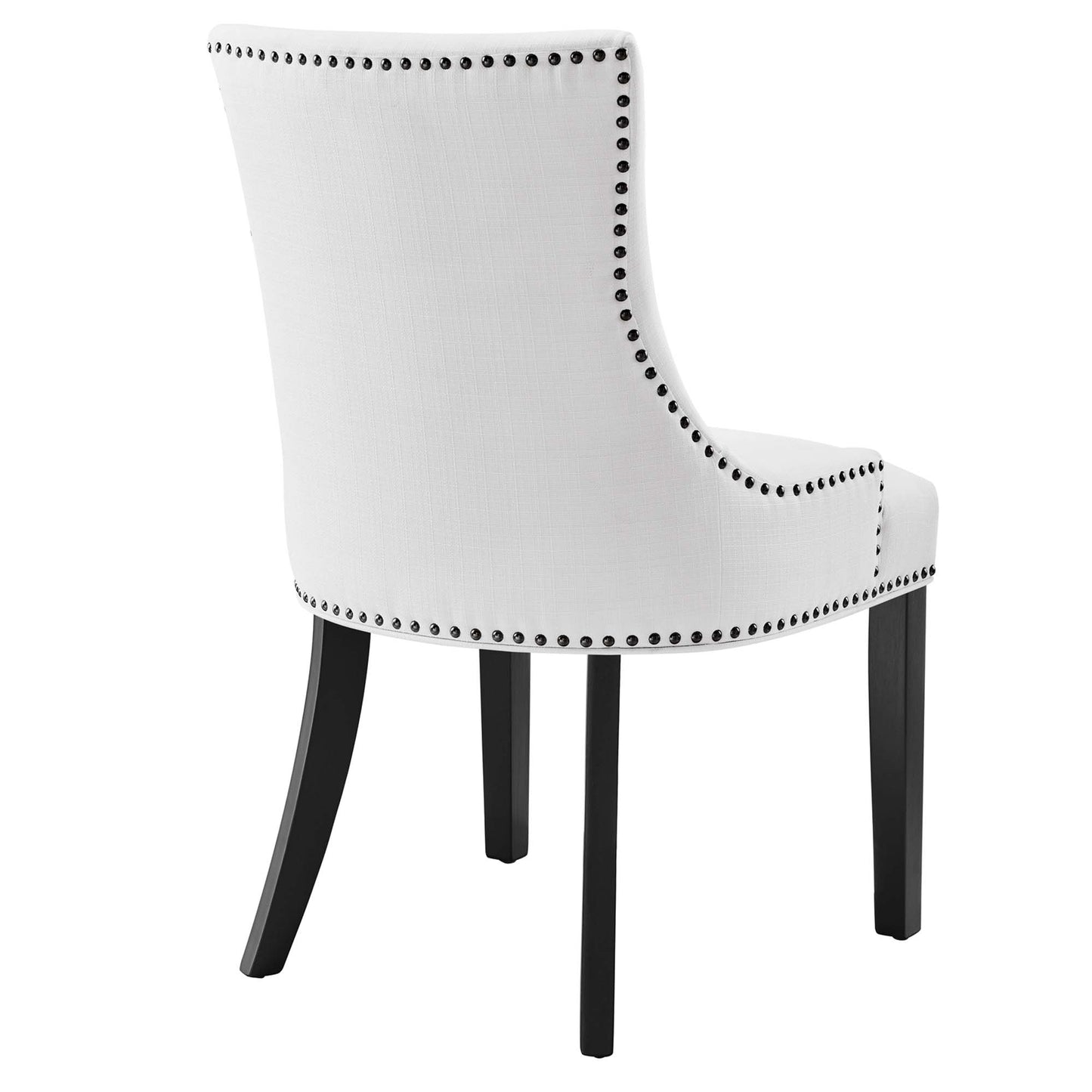 White fabric-upholstered dining chair with curved back, black nailhead trim, and black wooden legs.