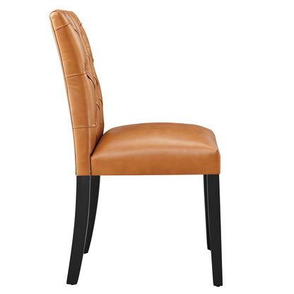 Tan vegan leather dining chair with button-tufted back, padded seat, and black wooden legs — side view.