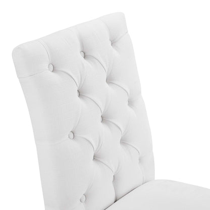 White tufted fabric dining chair with button-tufted grid, curved high back, modern elegant style.