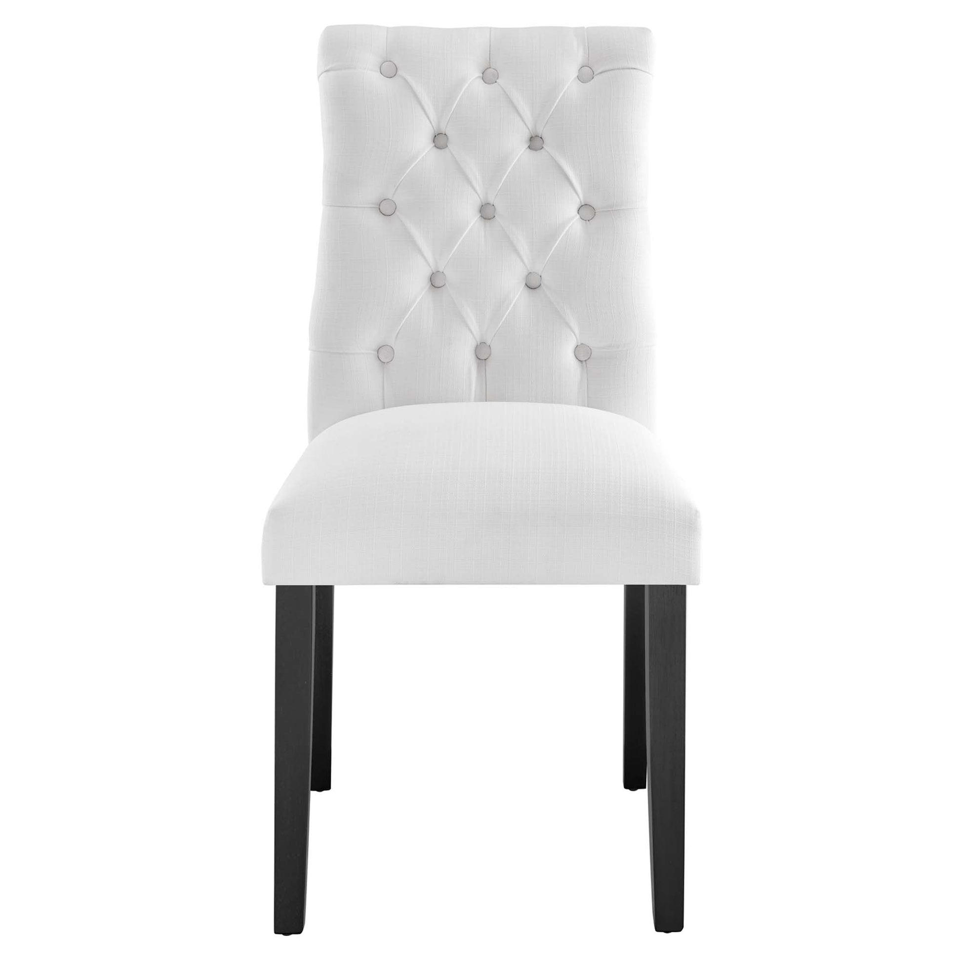 White fabric-covered dining chair with tufted back, button details, cushioned seat, and dark wood legs.
