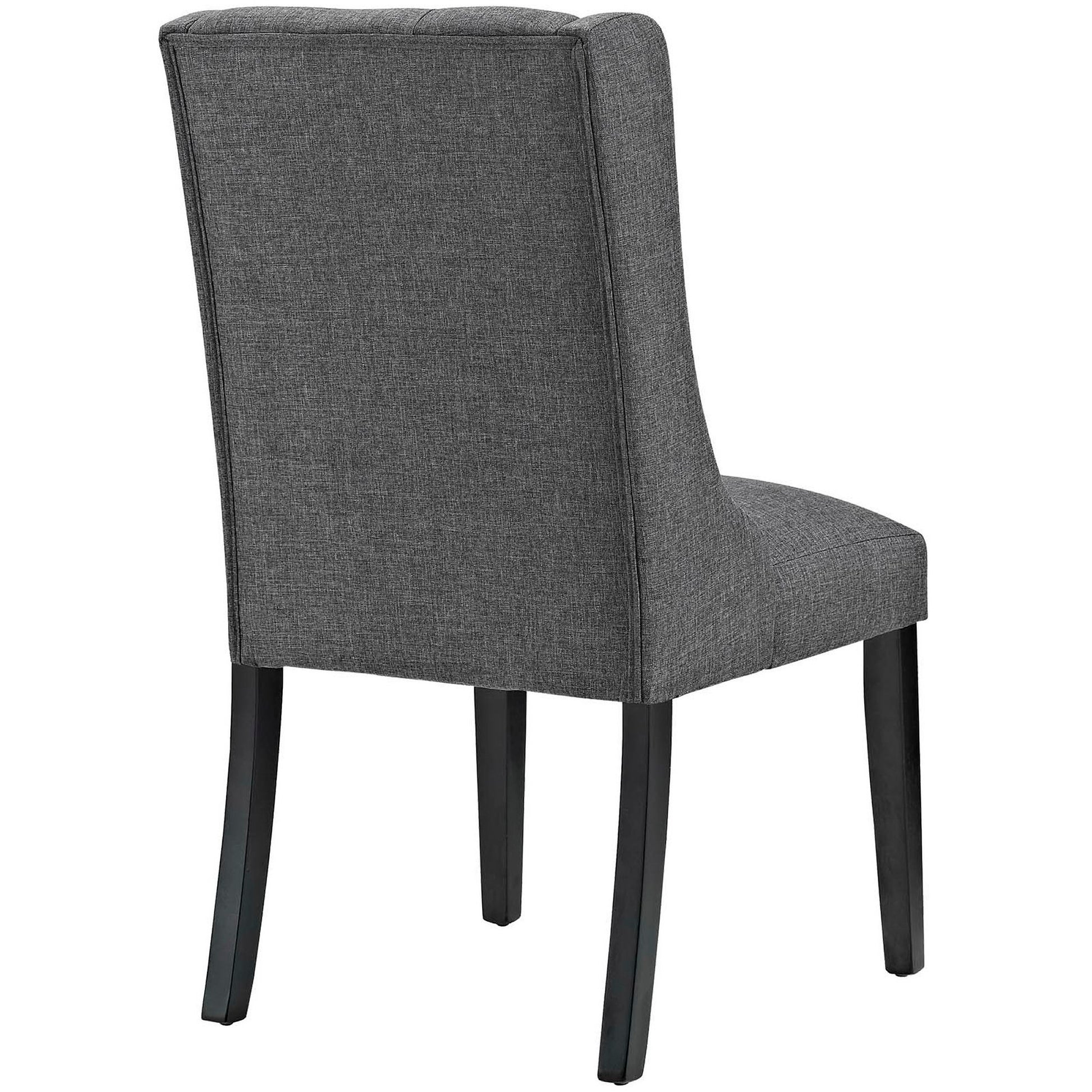 Gray fabric dining chair with high back, armless design, and dark tapered wooden legs.