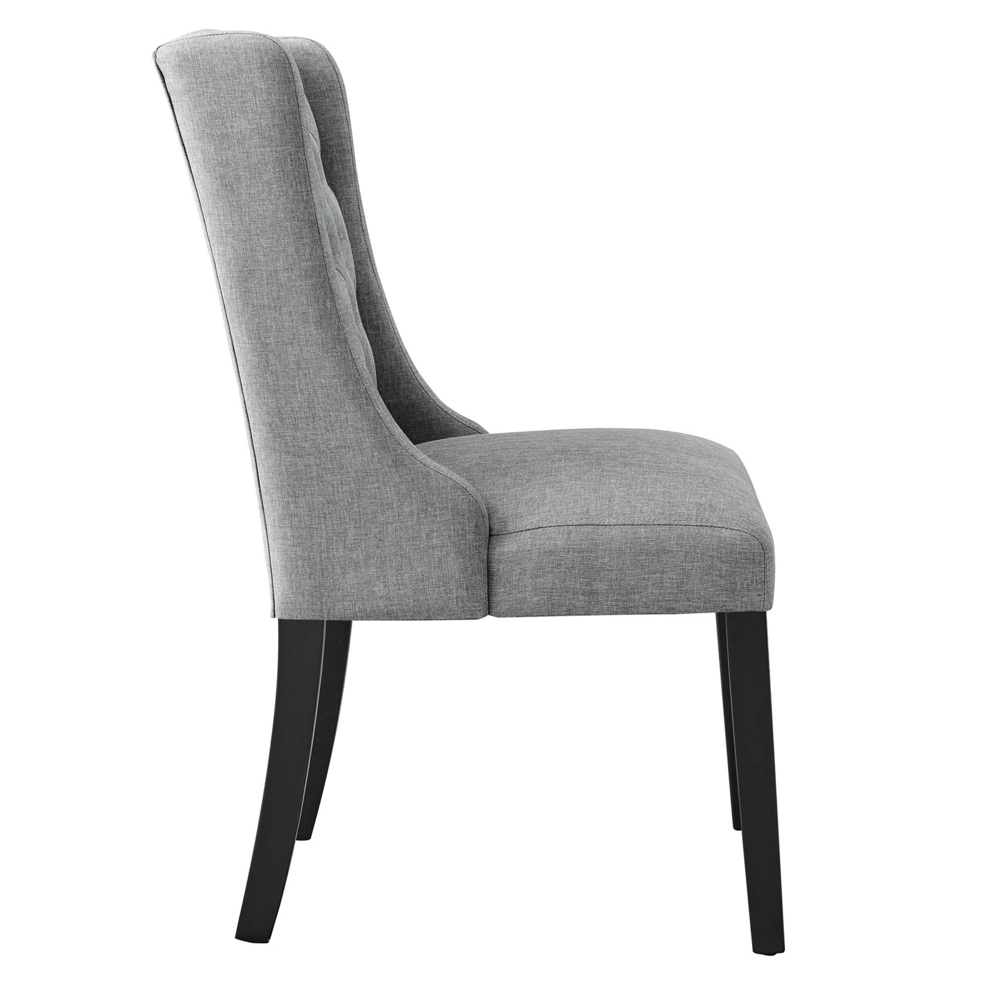 Gray fabric dining chair with a tall curved back, button-tufted upholstery, cushioned seat, and black tapered legs.