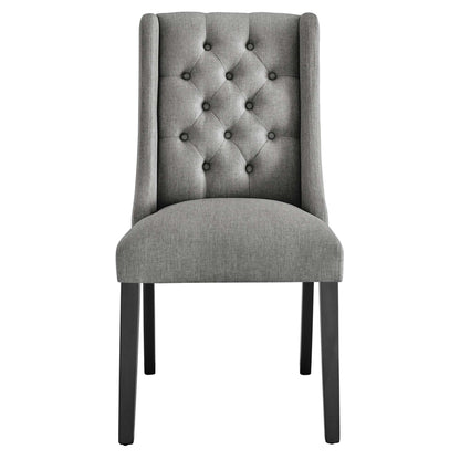Gray fabric button-tufted dining chair with tall back, cushioned seat, black legs.