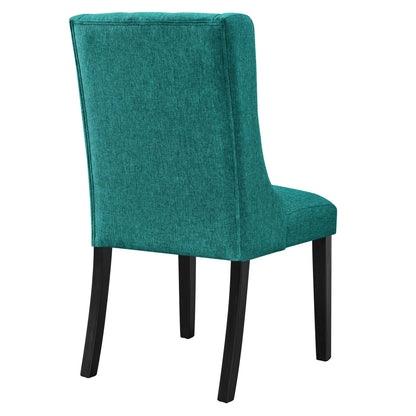 Teal button-tufted fabric dining chair with tall back and black wooden legs.