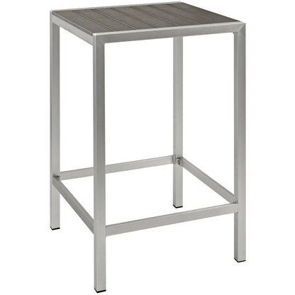 Gray aluminum outdoor bar table with a square top and four straight legs.