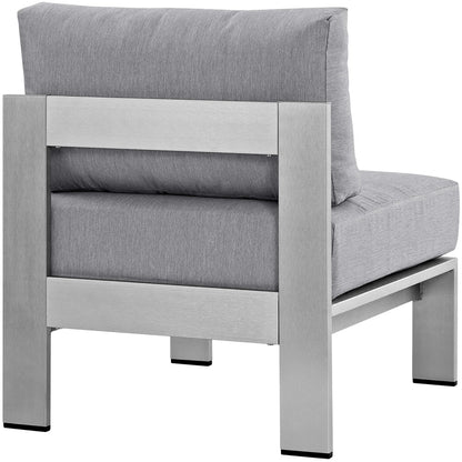 Modern gray outdoor aluminum armless patio chair with chunky cushions.