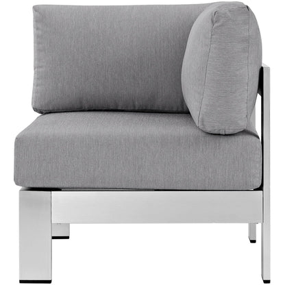 Gray outdoor aluminum corner sofa with cushioned seats and backs; modular sectional.