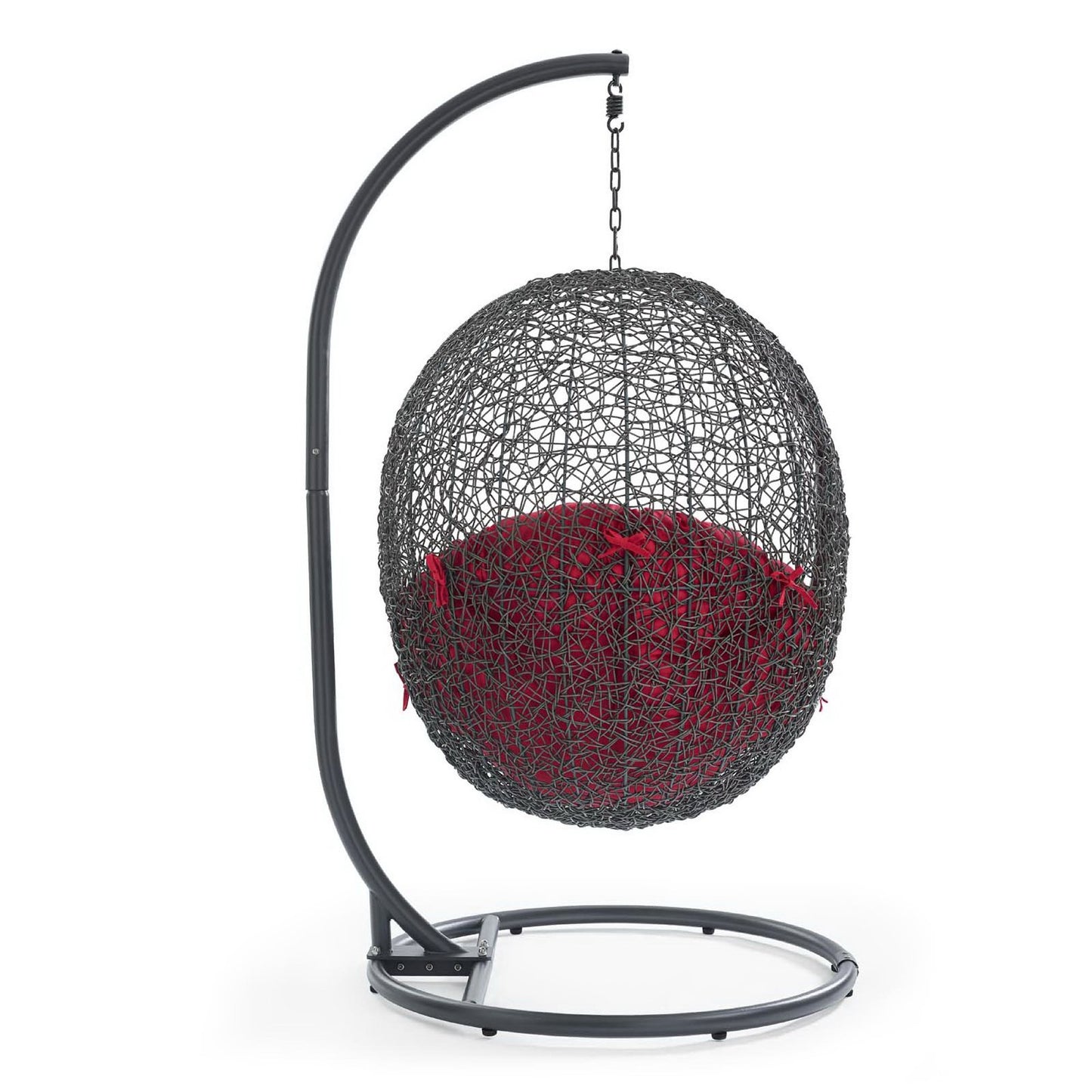 Gray metal outdoor swing chair with red cushion, suspended from a curved stand with chain.