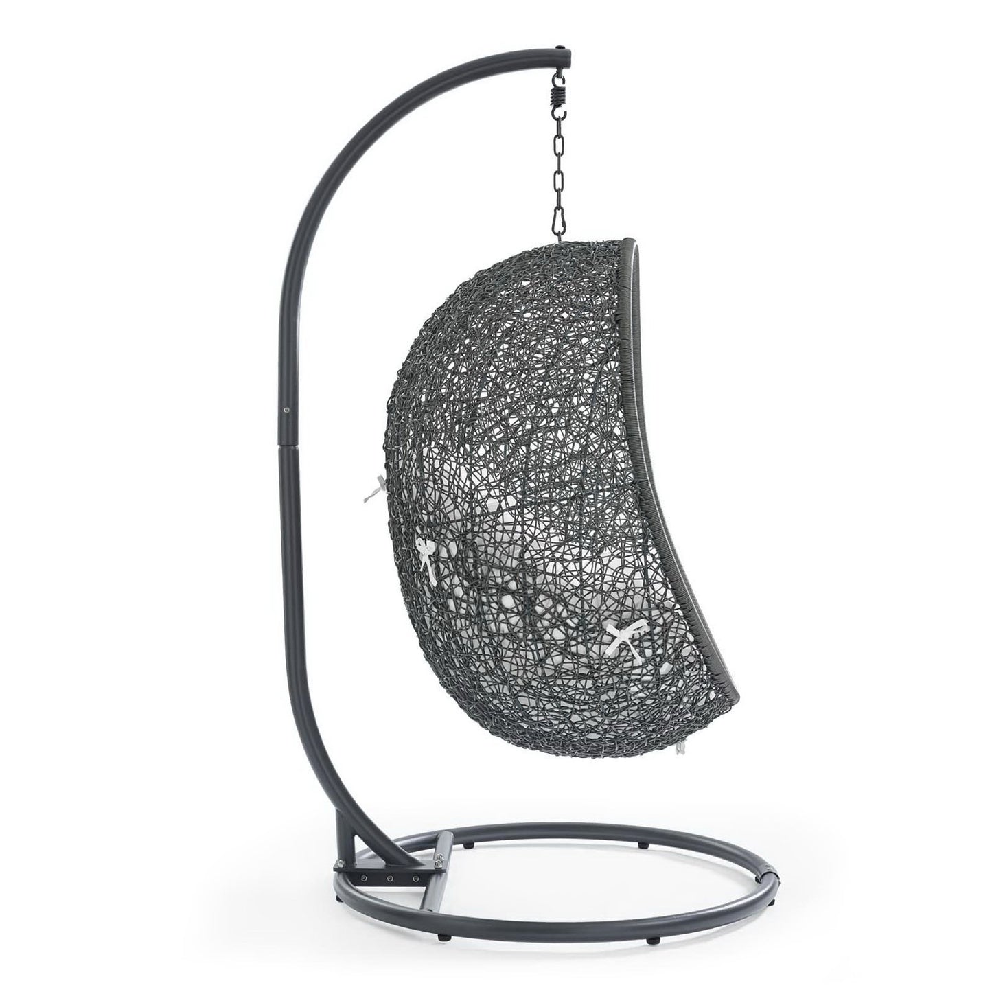 White woven half-sphere outdoor swing chair hanging from a curved metal stand for patio.