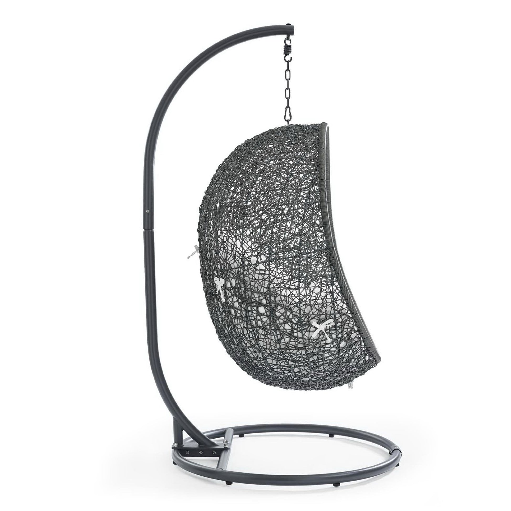 White woven half-sphere outdoor swing chair hanging from a curved metal stand for patio.