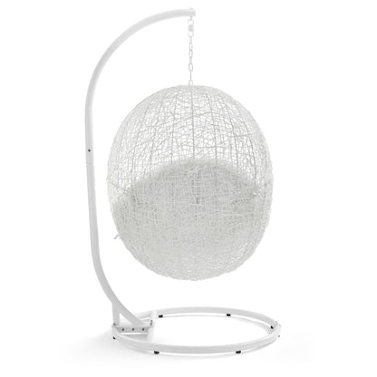 White woven spherical hanging chair on a curved metal stand with chain