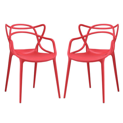 Pair of red molded plastic chairs with sculpted looped backrests and slender legs.