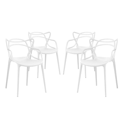 Set of four white molded-plastic dining chairs with curved backs and slender legs, modern minimalist style.