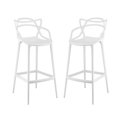 White metal bar stools with round seats, sculptural petal-back arms, slim legs and footrests.