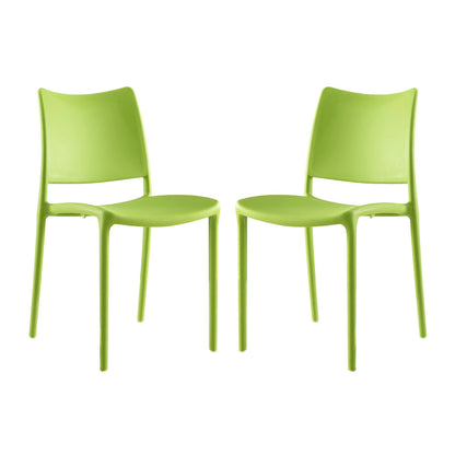 Set of 2 lime green plastic dining chairs with curved backs and slender legs in a modern minimalist style.
