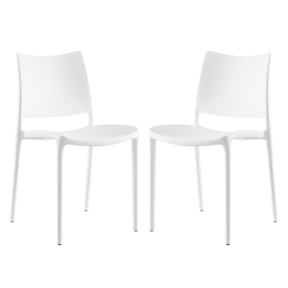 Pair of white modern dining side chairs with curved backrests and slim metal legs.