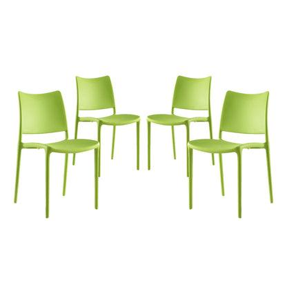 Four lime-green plastic dining chairs with curved backs and slender legs, modern minimalist dining set.