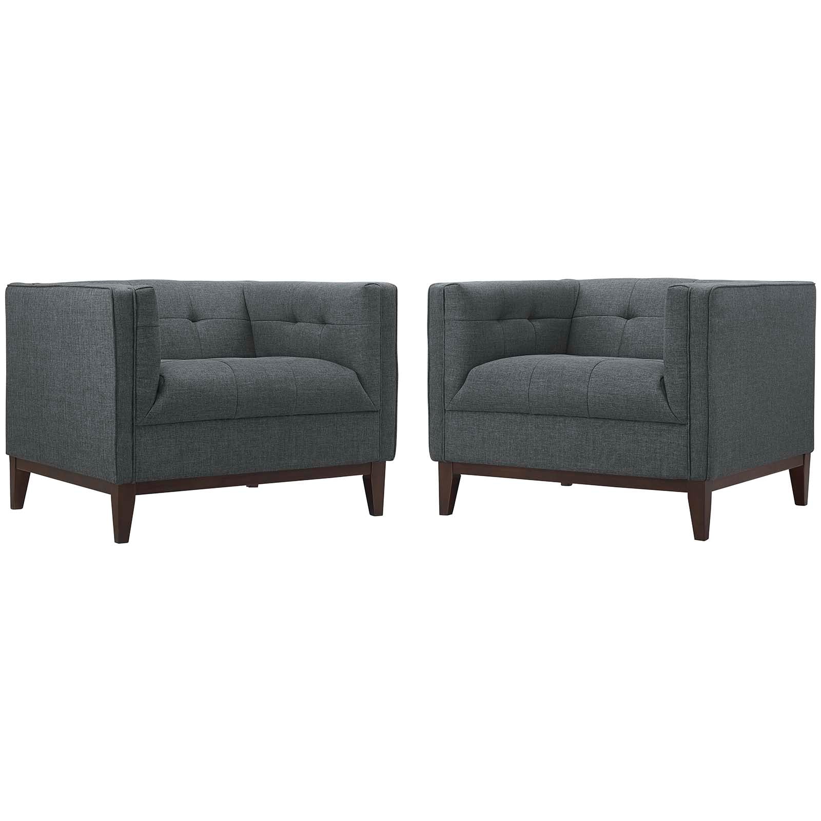Pair of charcoal gray fabric armchairs with tufted back, square arms, and tapered wooden legs.