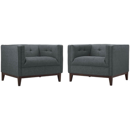 Pair of charcoal gray fabric armchairs with tufted back, square arms, and tapered wooden legs.