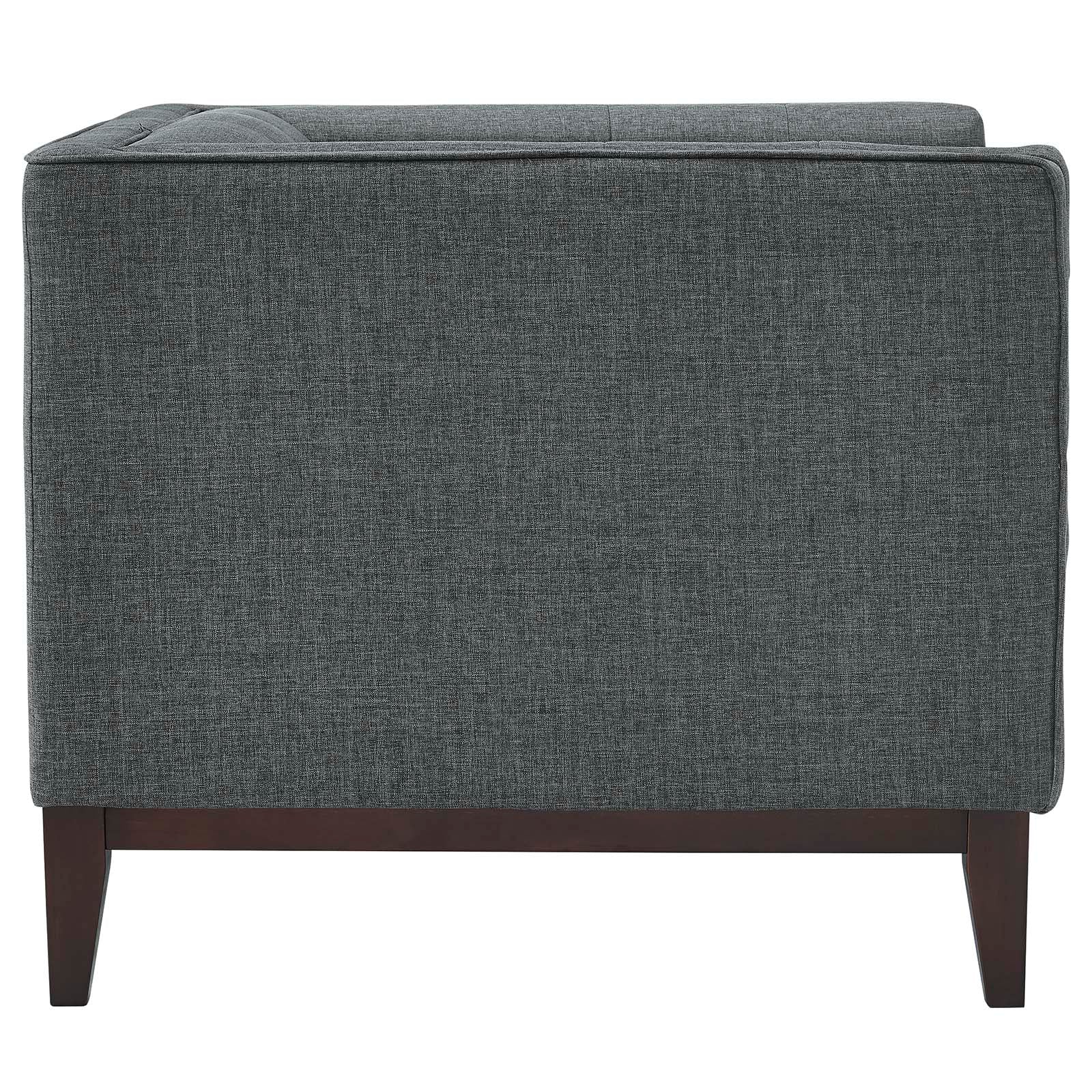 Rear view of two gray fabric armchairs with dark wood tapered legs in a mid-century modern style.