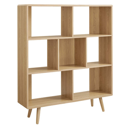 Oak-finish wood grain bookcase with 7 shelves and mid-century tapered legs.