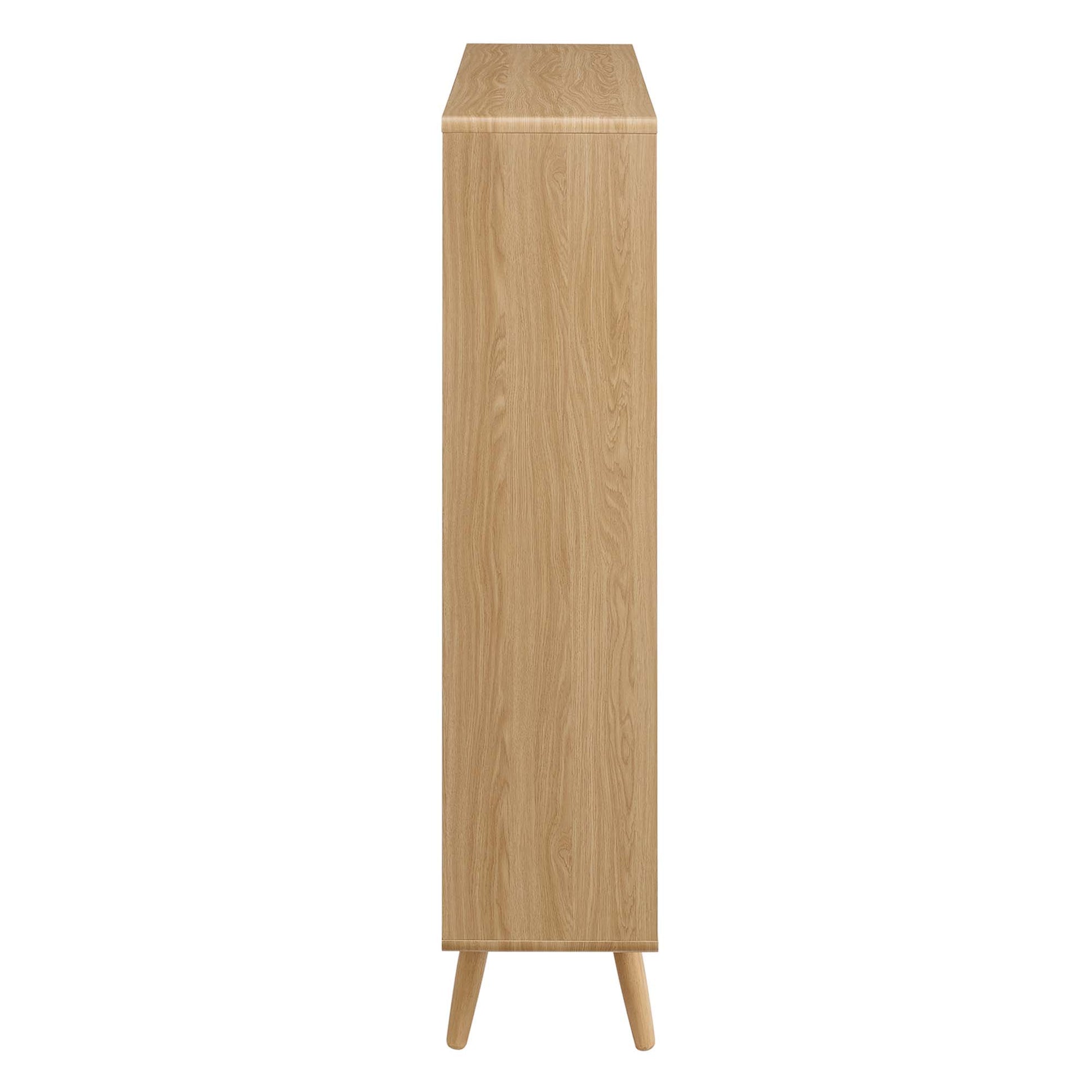 Tall oak wood bookcase with 7 shelves on tapered legs in mid-century modern style.