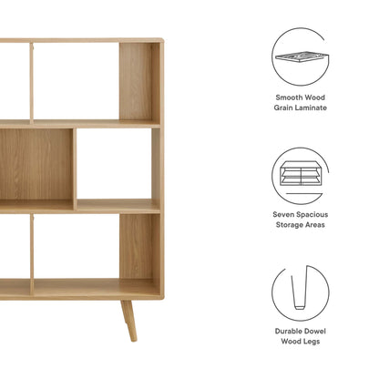 Natural oak wood bookshelf with seven open cubbies, mid-century frame and tapered legs.