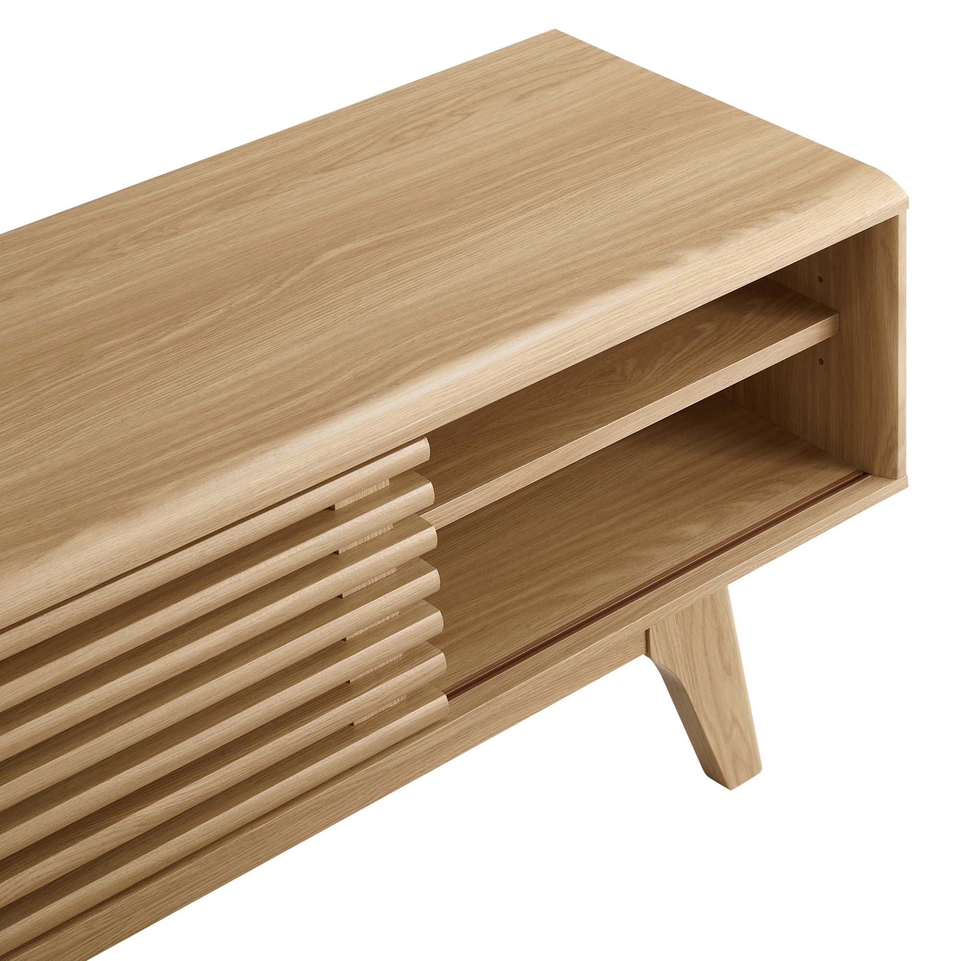 Natural oak wood TV stand with horizontal slats and an open shelf, mid-century modern style, angled legs.