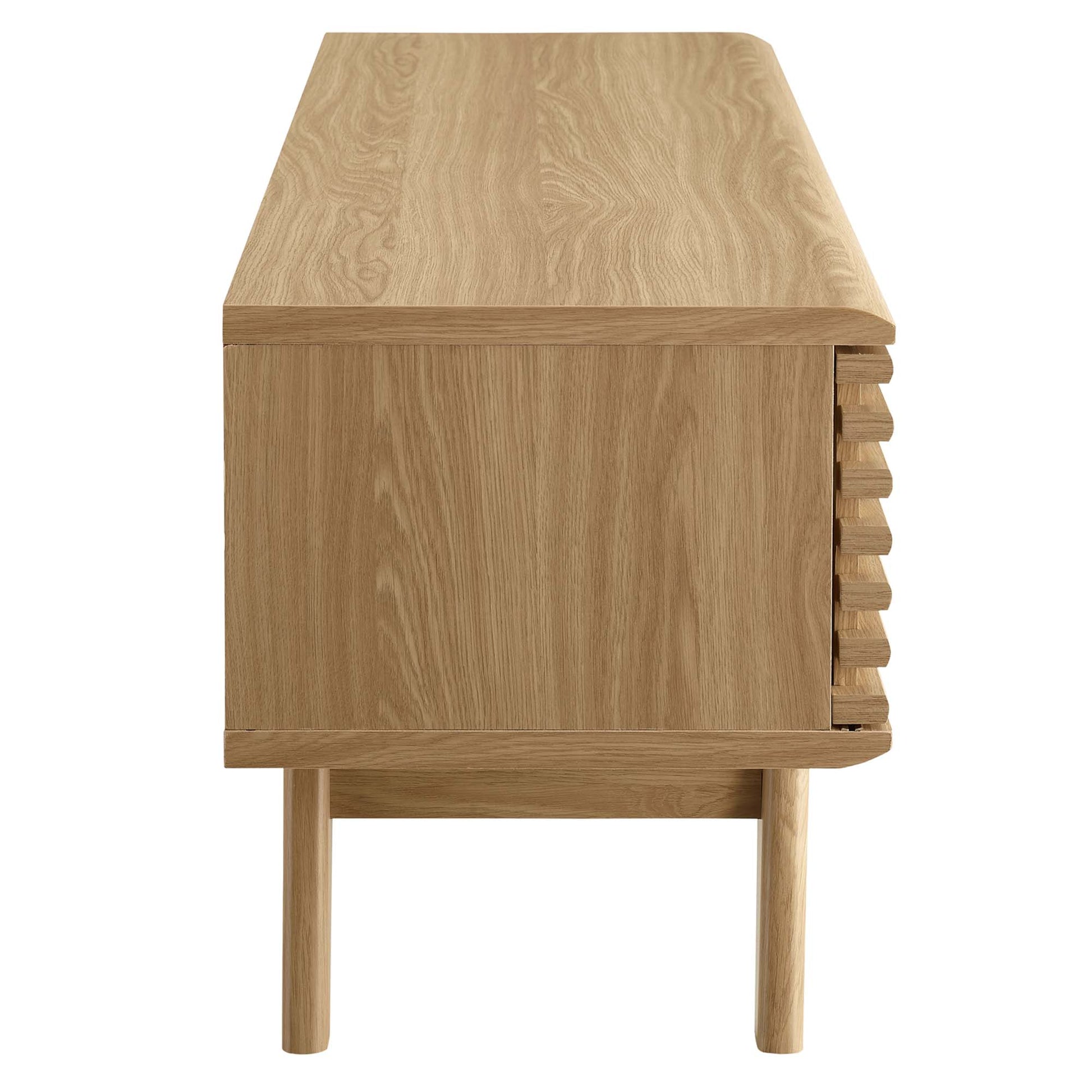 Oak wood TV stand with rectangular top, slender dowel legs, and a right-side slatted panel.