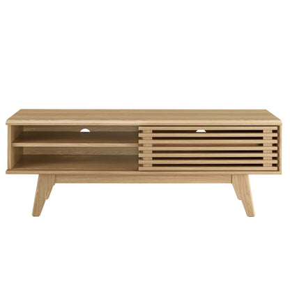 Oak wood TV stand with open left shelf, slatted right cabinet, mid-century legs, cable holes.